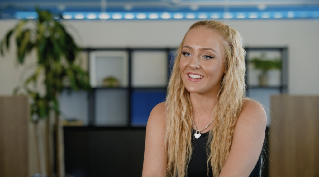 Screenshot of video interview with blonde female